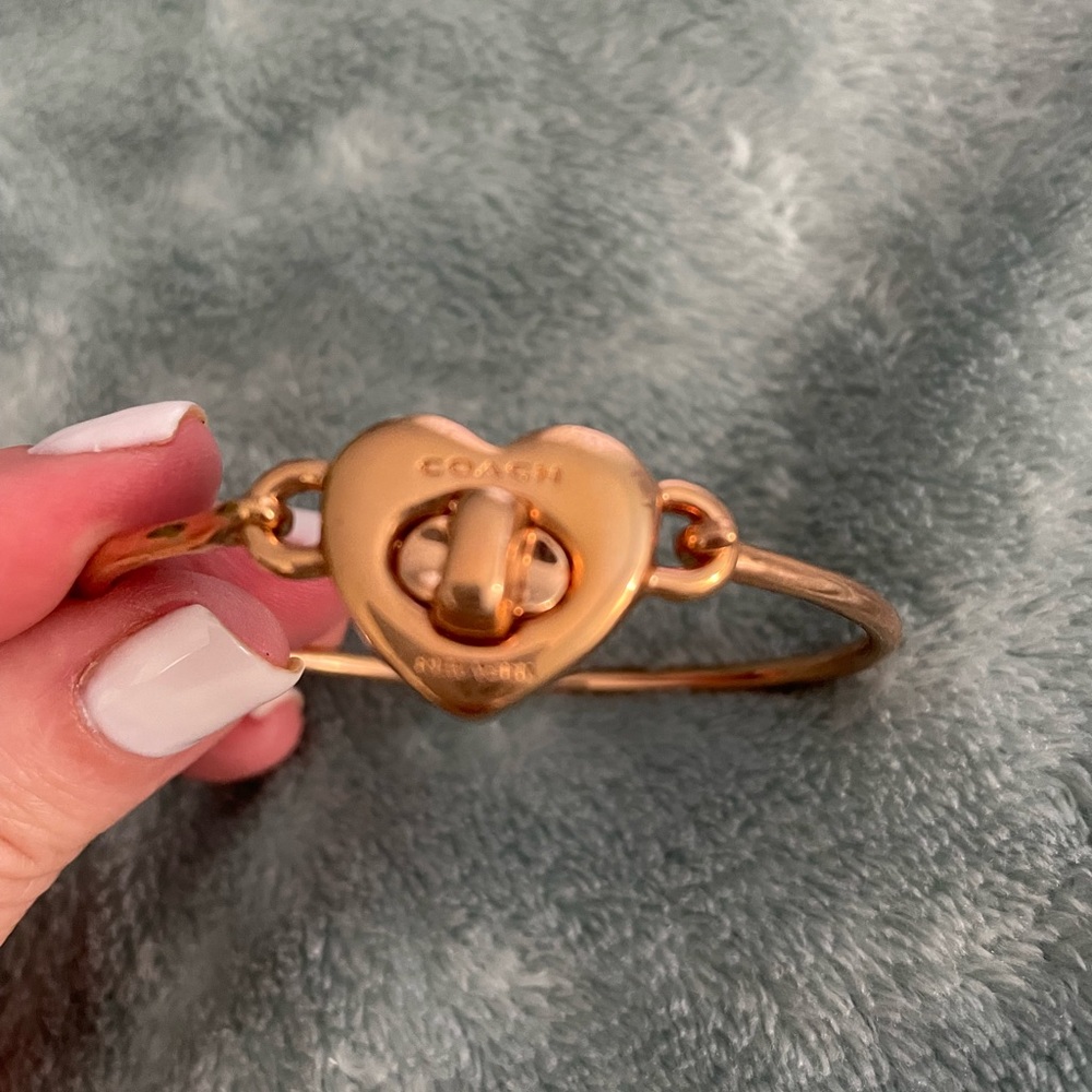 Beautiful Coach rose gold heart bracelet with turn lock.